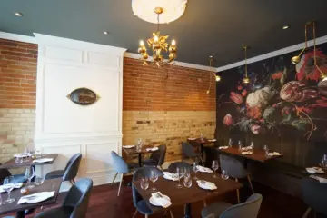 Warm dining room inside Avelo vegan restaurant in Toronto