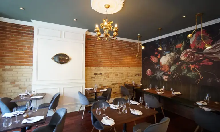 Warm dining room inside Avelo vegan restaurant in Toronto
