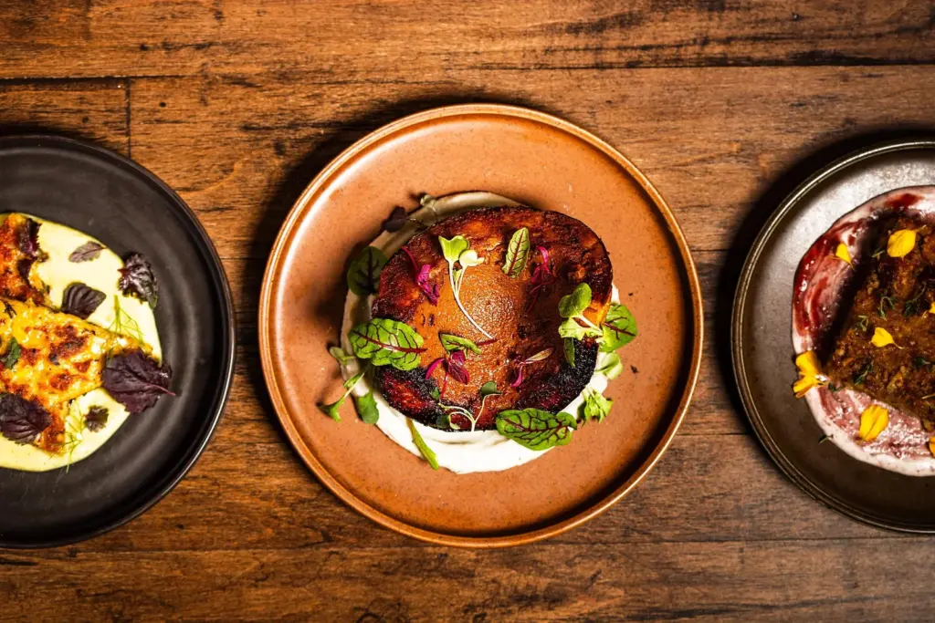 Colourful plant-based dishes arranged on a table at Hawker in Kensington Market