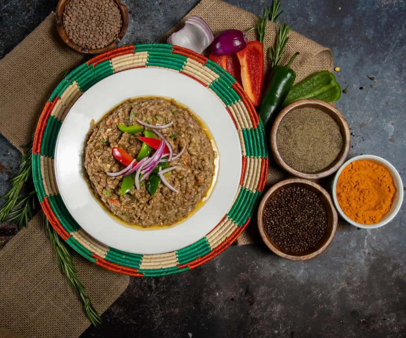 Ethiopian stew presented with spices and vegetables at La Vegan