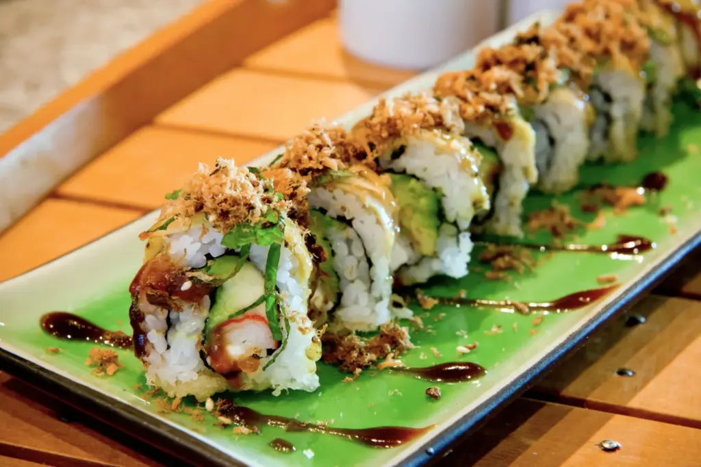 Vegan sushi roll topped with crisp garnish at Tenon in Toronto