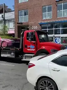 A tow truck carrying a vehicle in Toronto