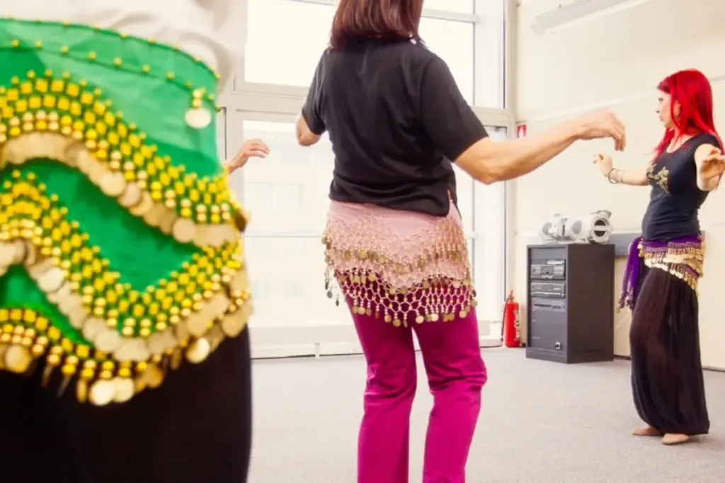 Women learning belly dance together in a TDSB Learn4Life class