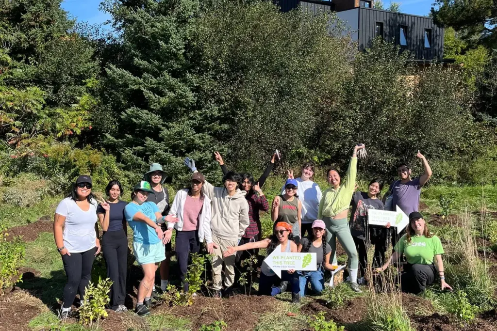 Toronto ravine volunteers smiling together after planting in a community park
