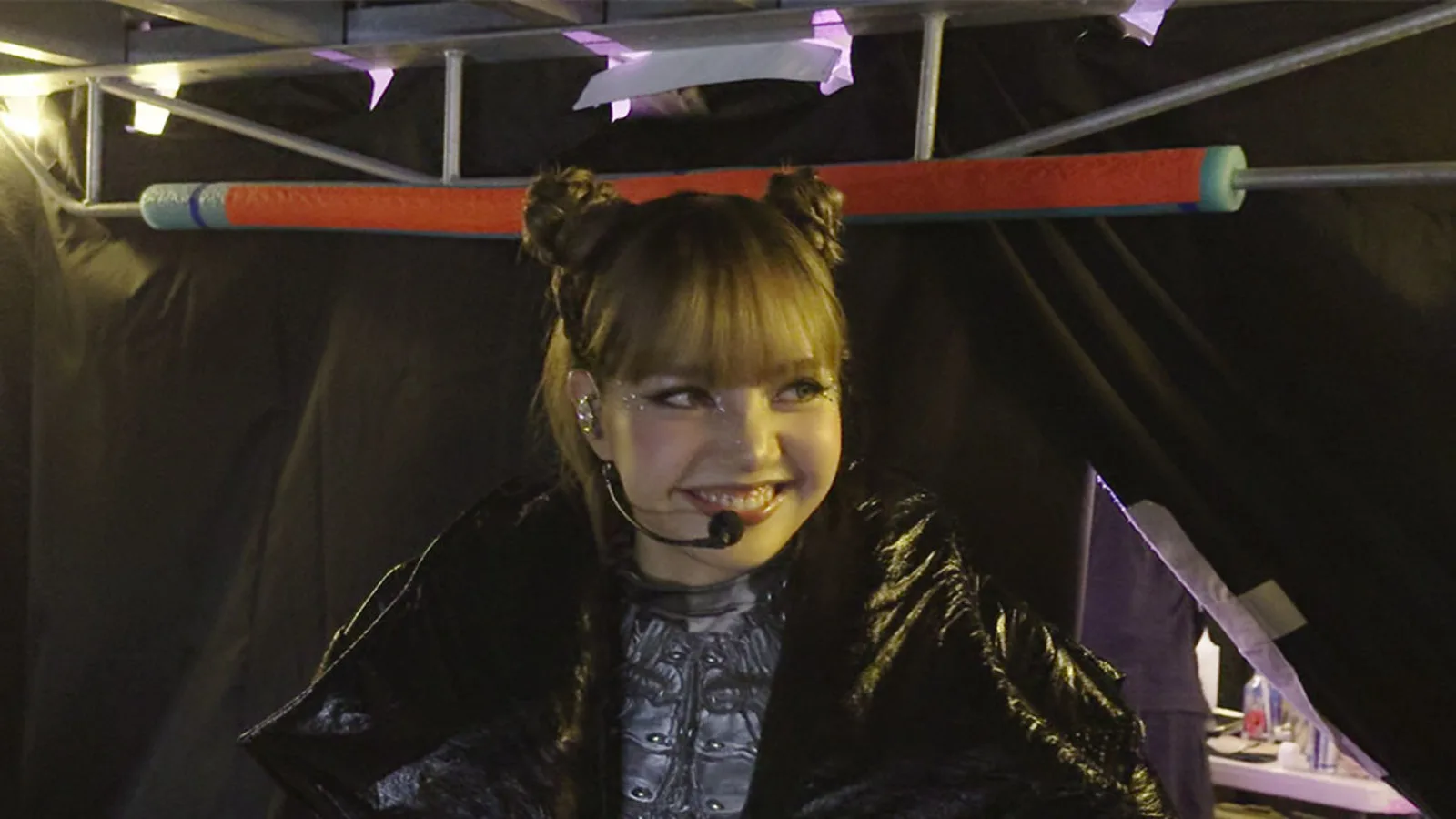 Lisa looks over her shoulder in a still from the documentary Always Lalisa