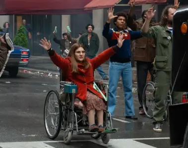 Judith Heumann supporters stop traffic in a scene from Being Heumann