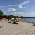 Families swimming and relaxing at Marie Curtis Park East Beach
