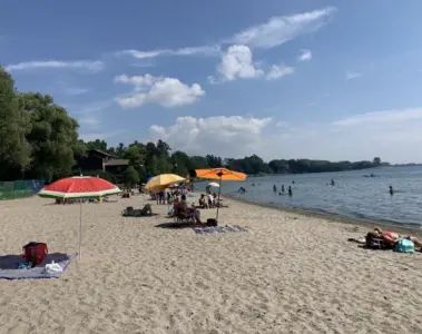 Families swimming and relaxing at Marie Curtis Park East Beach