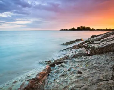 Colourful sunset above the rocky edge of Woodbine Beach