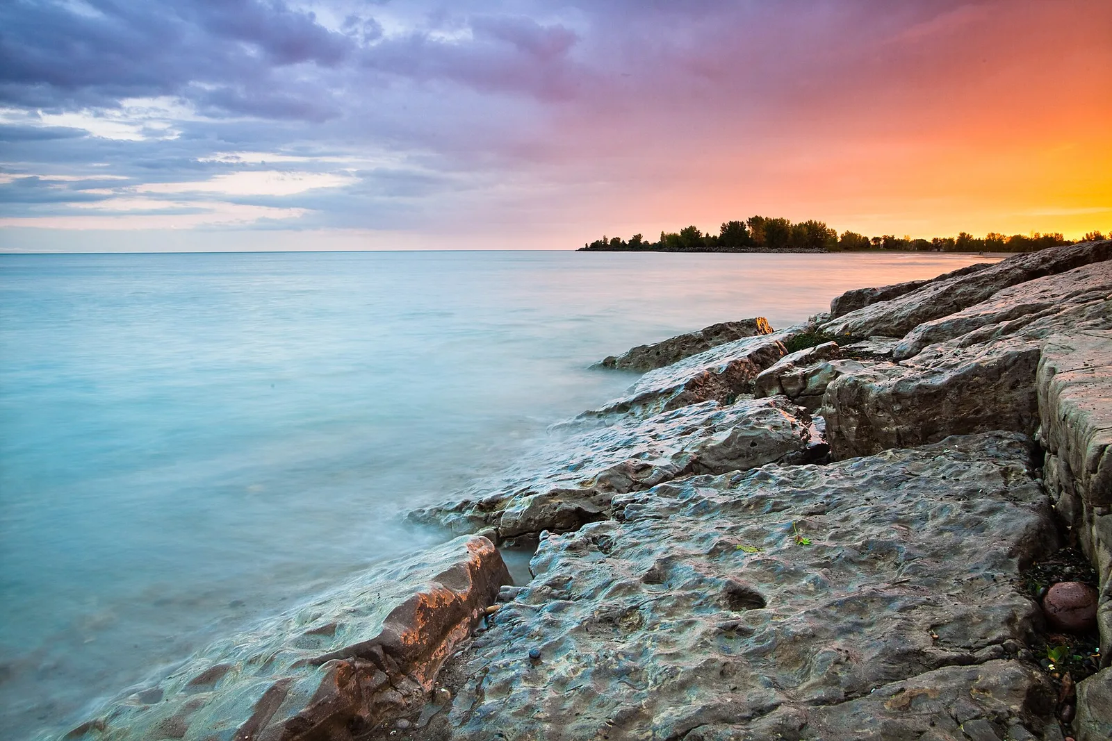 Colourful sunset above the rocky edge of Woodbine Beach