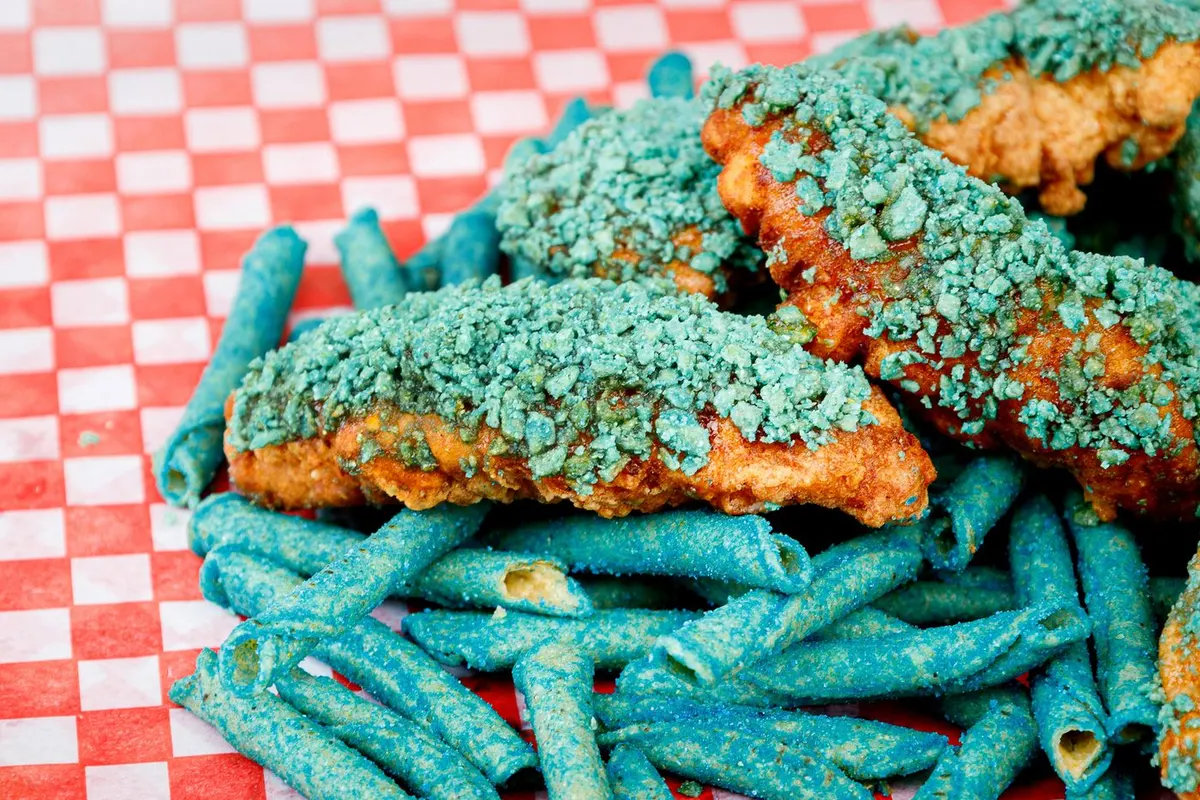 Blue Heat Taki chicken tenders with a cup of dip