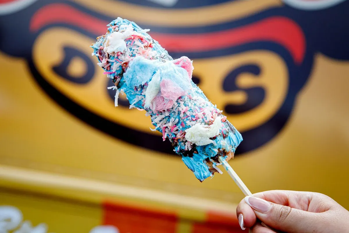 Waffle-battered jerk chicken hot dog topped with cotton candy