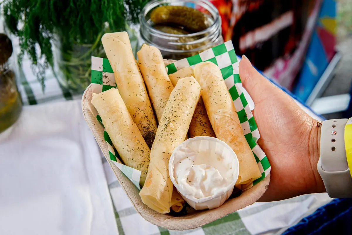 Fried dill pickle pierogi spring rolls with sour cream