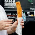 Footlong fried taquito filled with butter chicken, rice and cheese