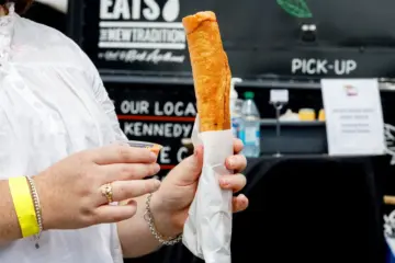Footlong fried taquito filled with butter chicken, rice and cheese