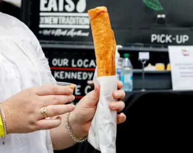 Footlong fried taquito filled with butter chicken, rice and cheese