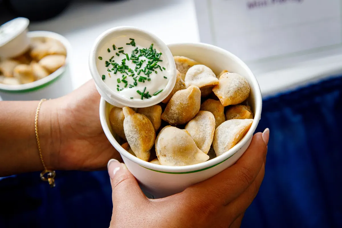 Jamaican beef patty mini pierogies with sour cream
