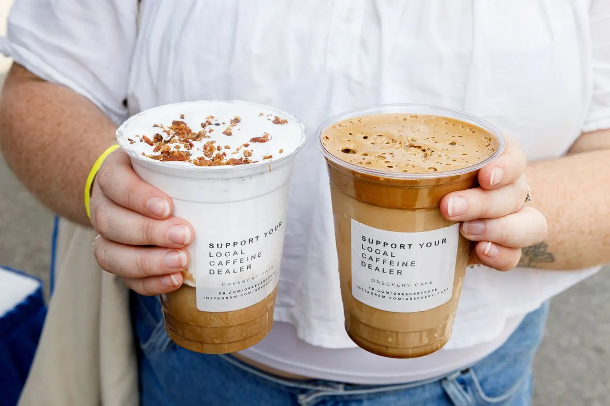 Two iced coffees with pickle and bacon flavoured cold foam