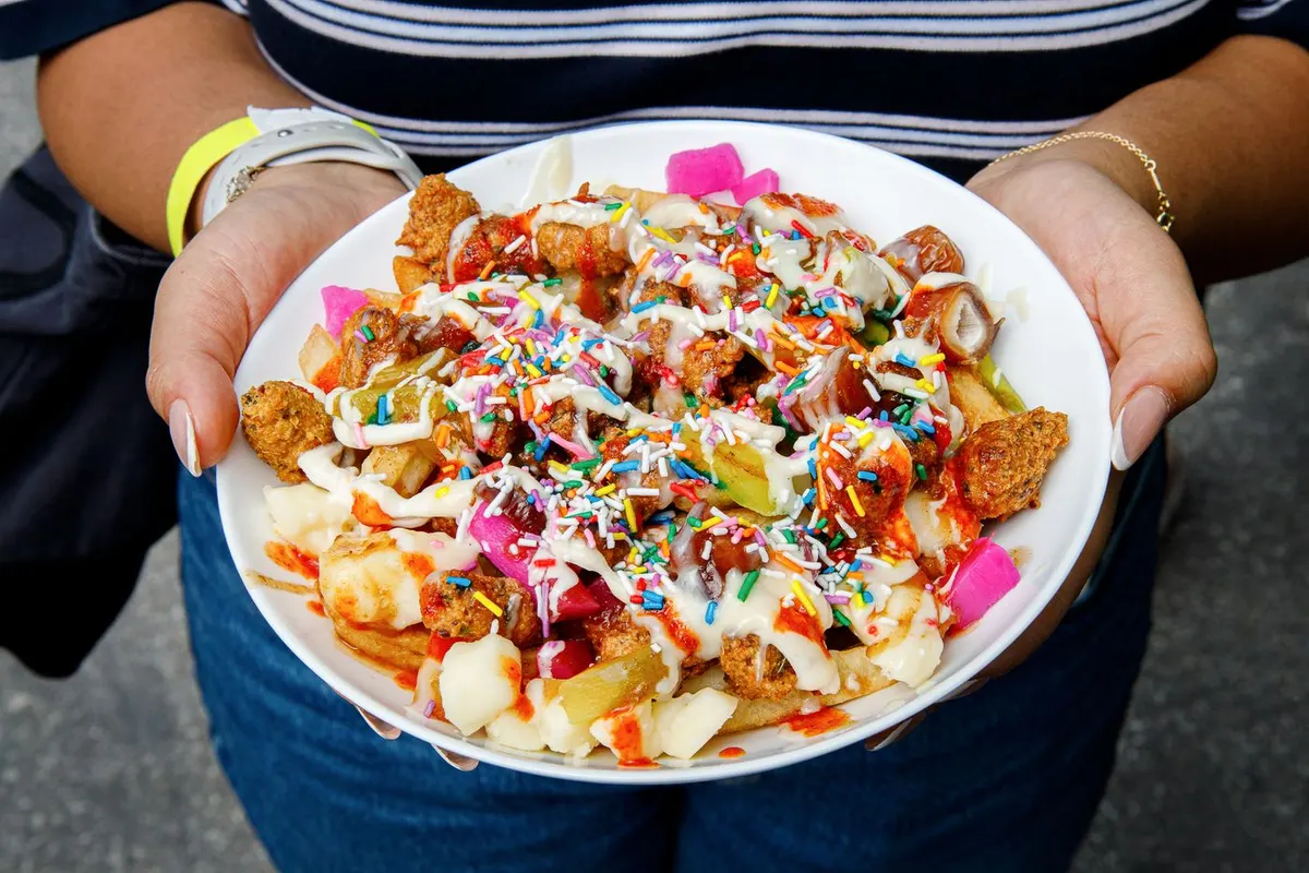 Falafel poutine with gravy, pickles, dates and tahini