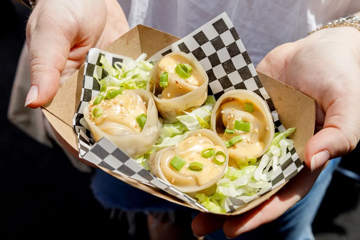 Steamed smash burger dumplings with burger sauce and sesame seeds