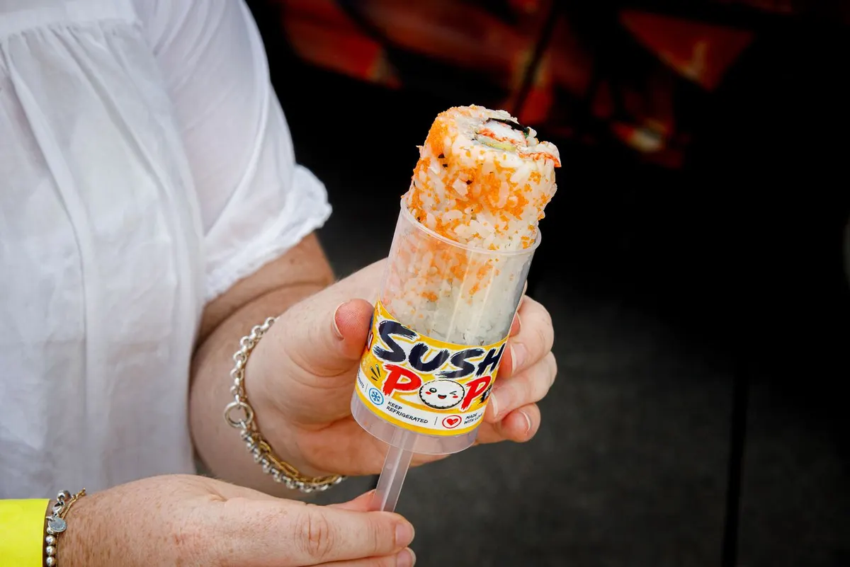 Sushi rice and fillings served in clear push-pop tubes
