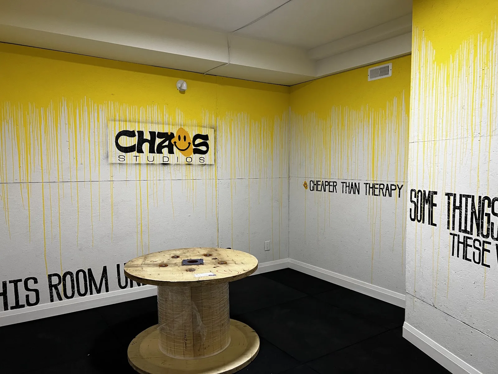 The yellow rage room inside Chaos Studios on College Street