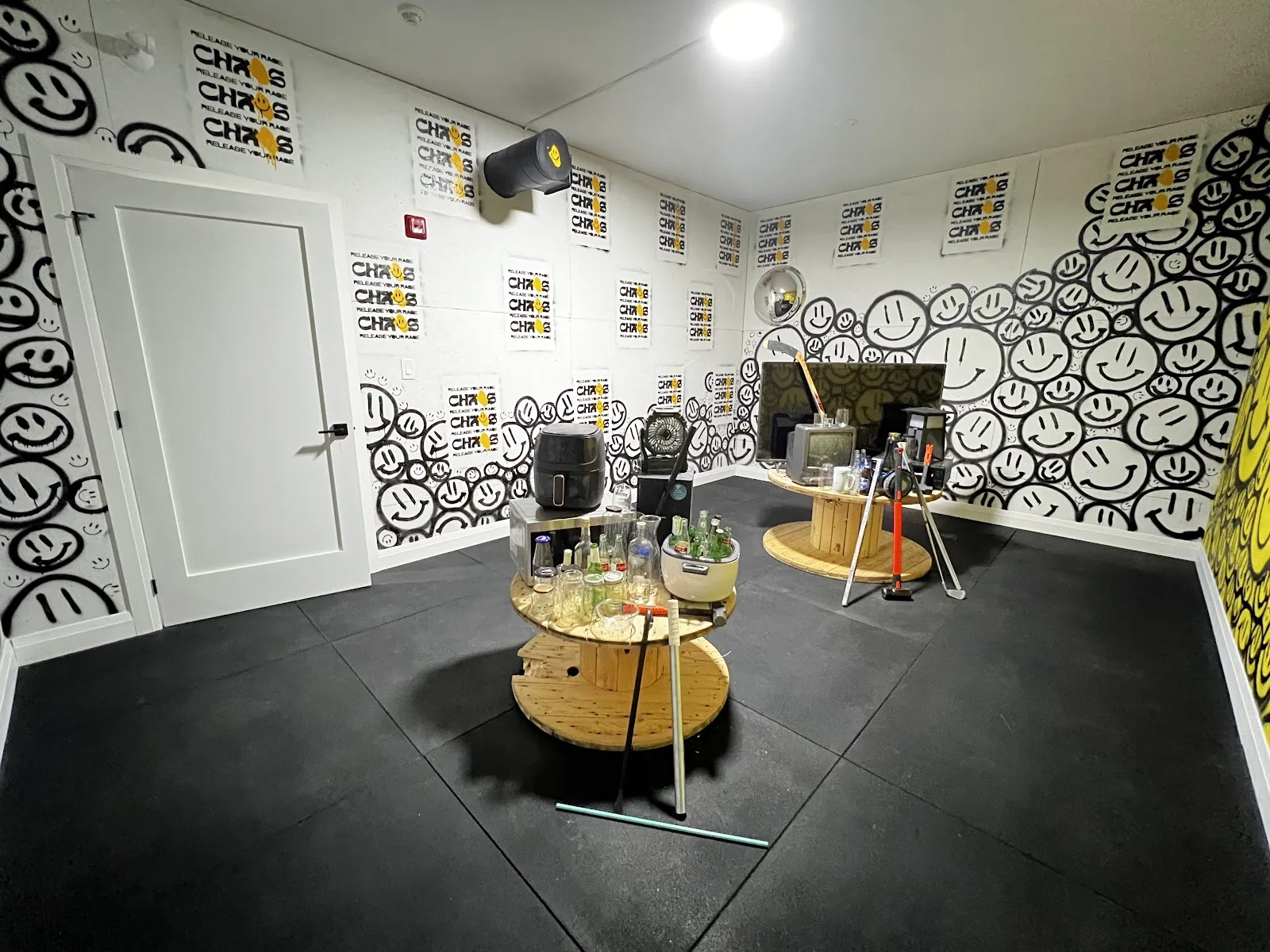 The black-and-white rage room inside Chaos Studios