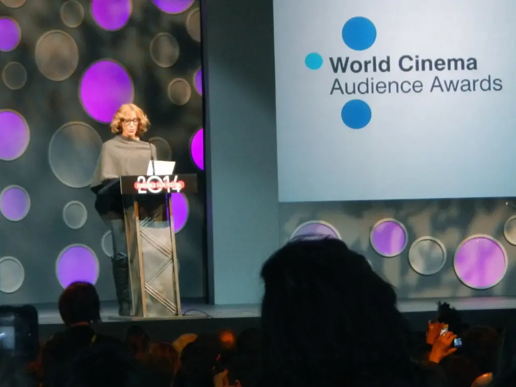 Audience seated in front of a cinema stage during a film event