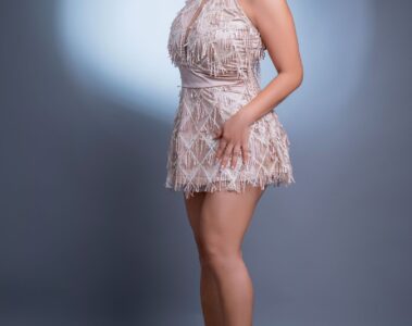 A woman wearing a modern cocktail dress