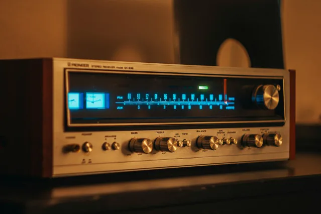 A restored vintage receiver glowing in a listening room