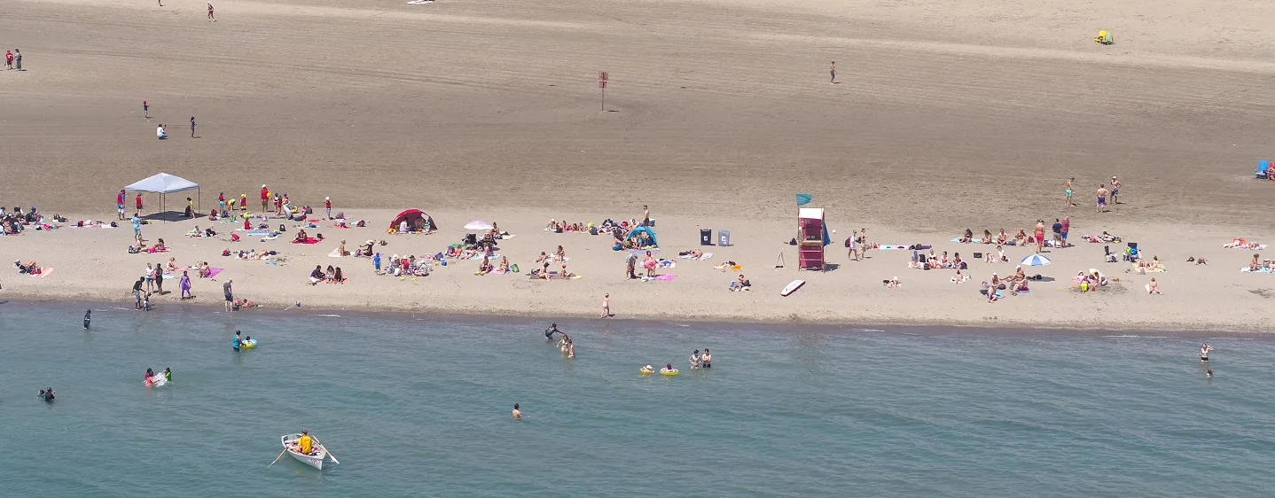 Aerial view of people swimming and relaxing at Woodbine Beach