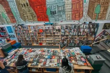 Customers browsing books inside BMV Books Annex in Toronto