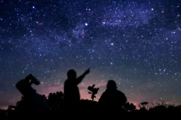 People using telescopes under a star-filled Ontario sky