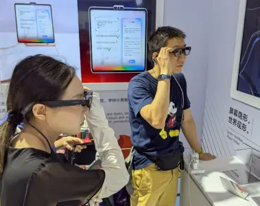 A woman and a man trying camera-equipped smart glasses at a technology exhibition