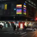 Toronto transit and pedestrians near College Street at night
