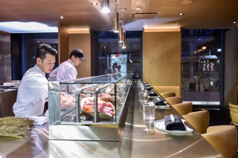 Open sushi counter and dining area inside Akira Back in Toronto