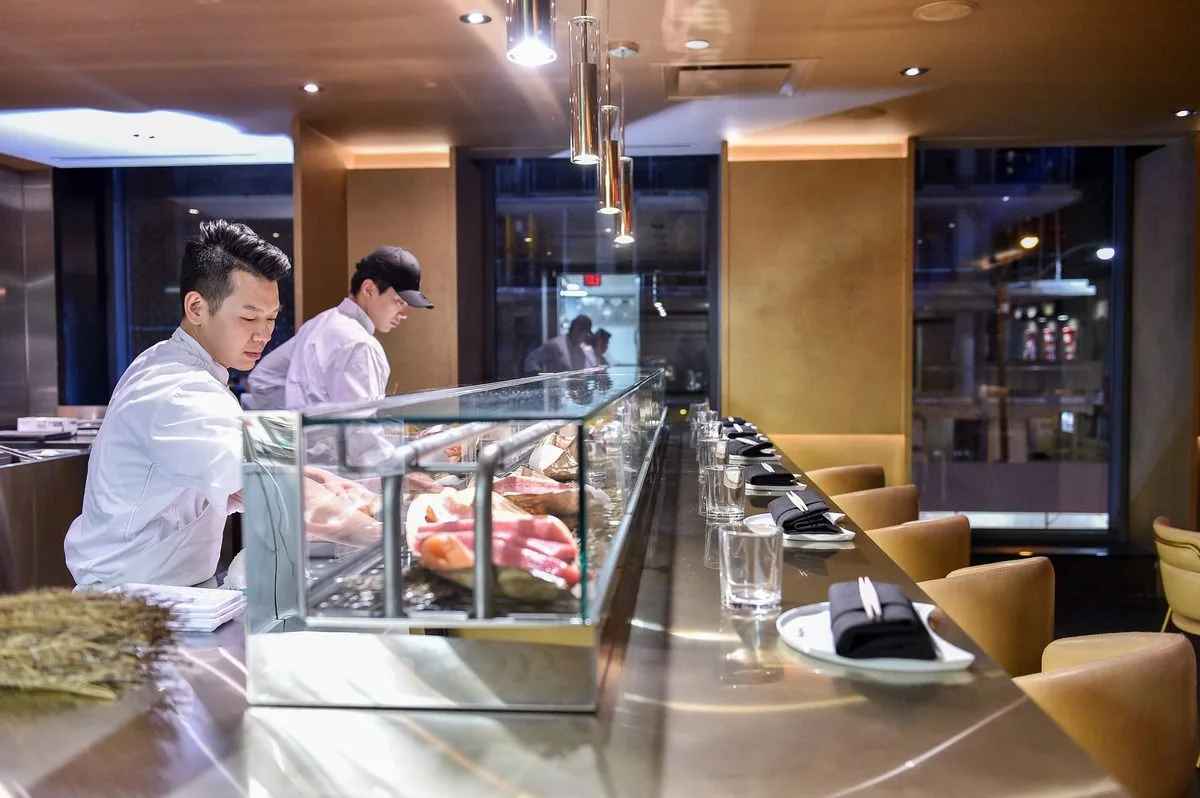 Open sushi counter and dining area inside Akira Back in Toronto