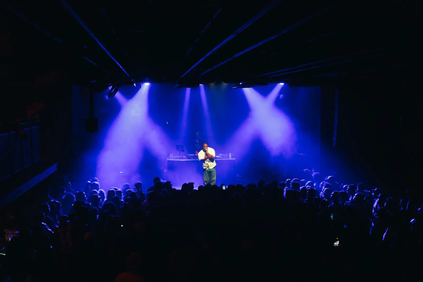 Concert stage and audience inside The Axis Club in Toronto