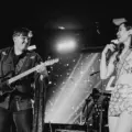 Singer and guitarist performing on stage at El Mocambo