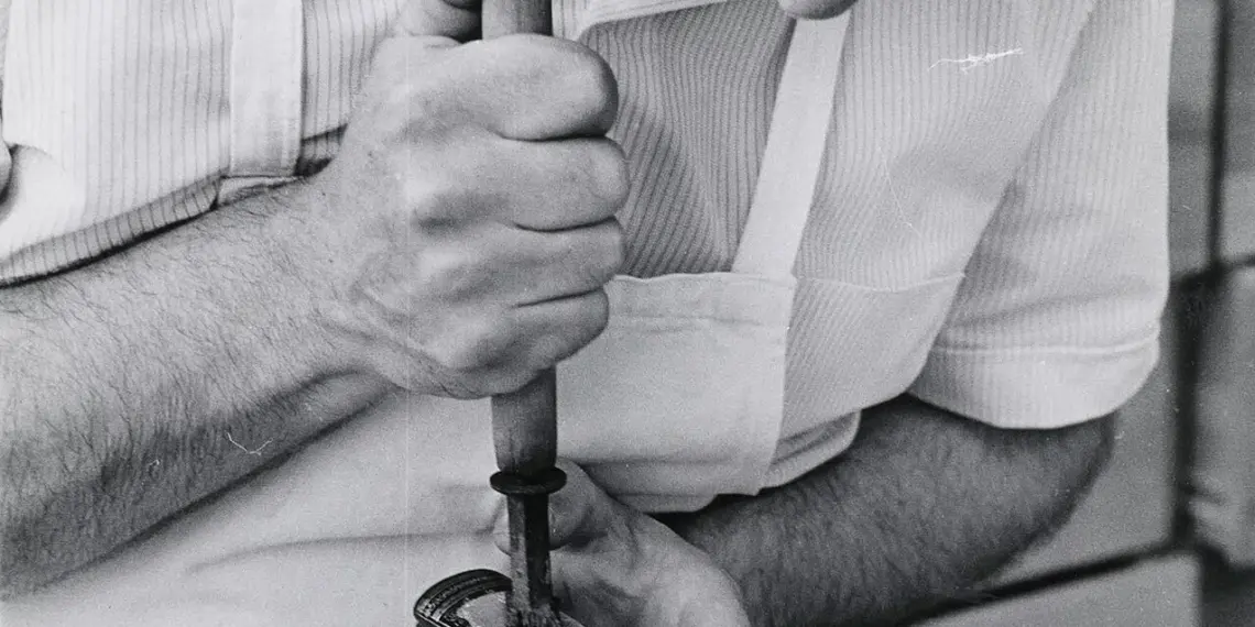 A Toronto Public Library worker restoring a book