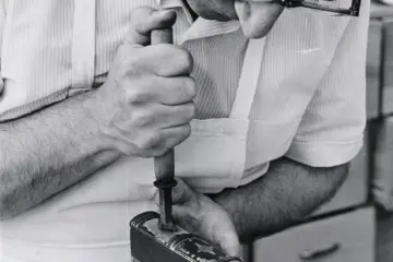 A Toronto Public Library worker restoring a book
