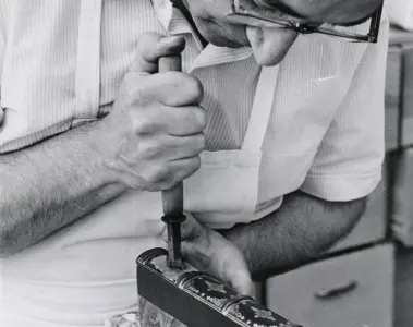 A Toronto Public Library worker restoring a book