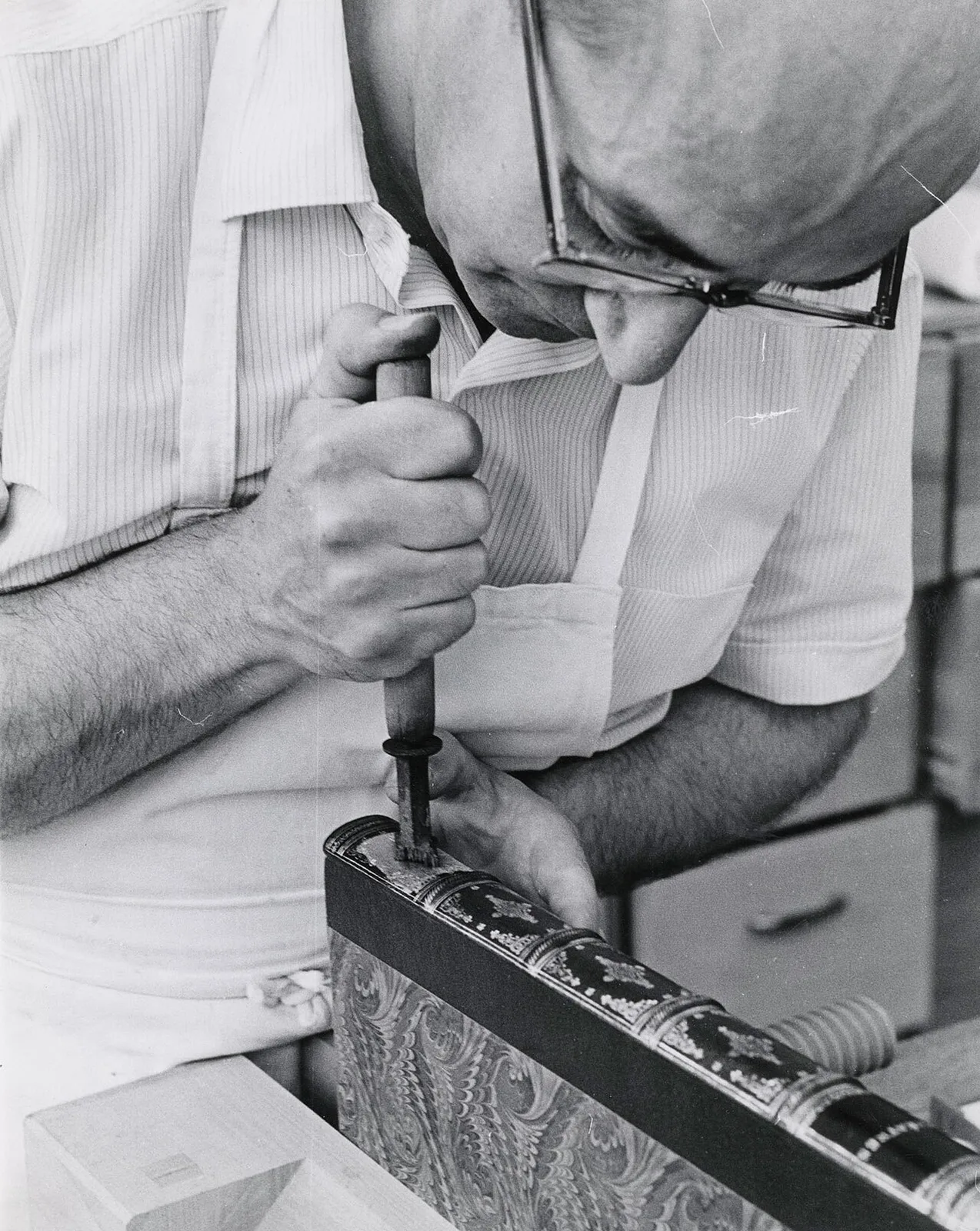 A Toronto Public Library worker restoring a book