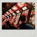 People playing a pinball machine at FreePlay Toronto