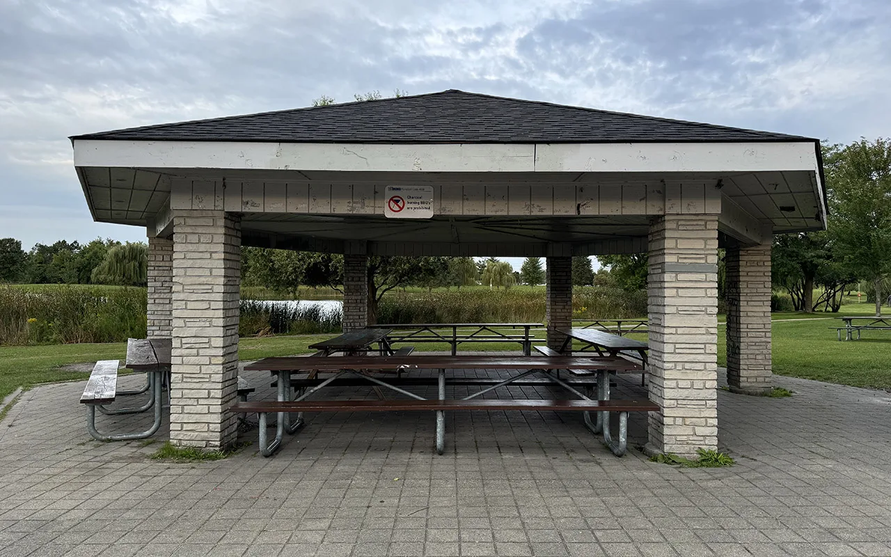 Picnic Site Eight beneath a white-roofed shelter at Centennial Park Etobicoke