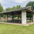 A large covered picnic shelter beside the playground at Christie Pits Park
