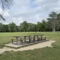 Picnic tables in an open grassy area at G. Ross Lord Park
