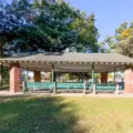 Covered Picnic Site 15 with tables on a lawn in High Park
