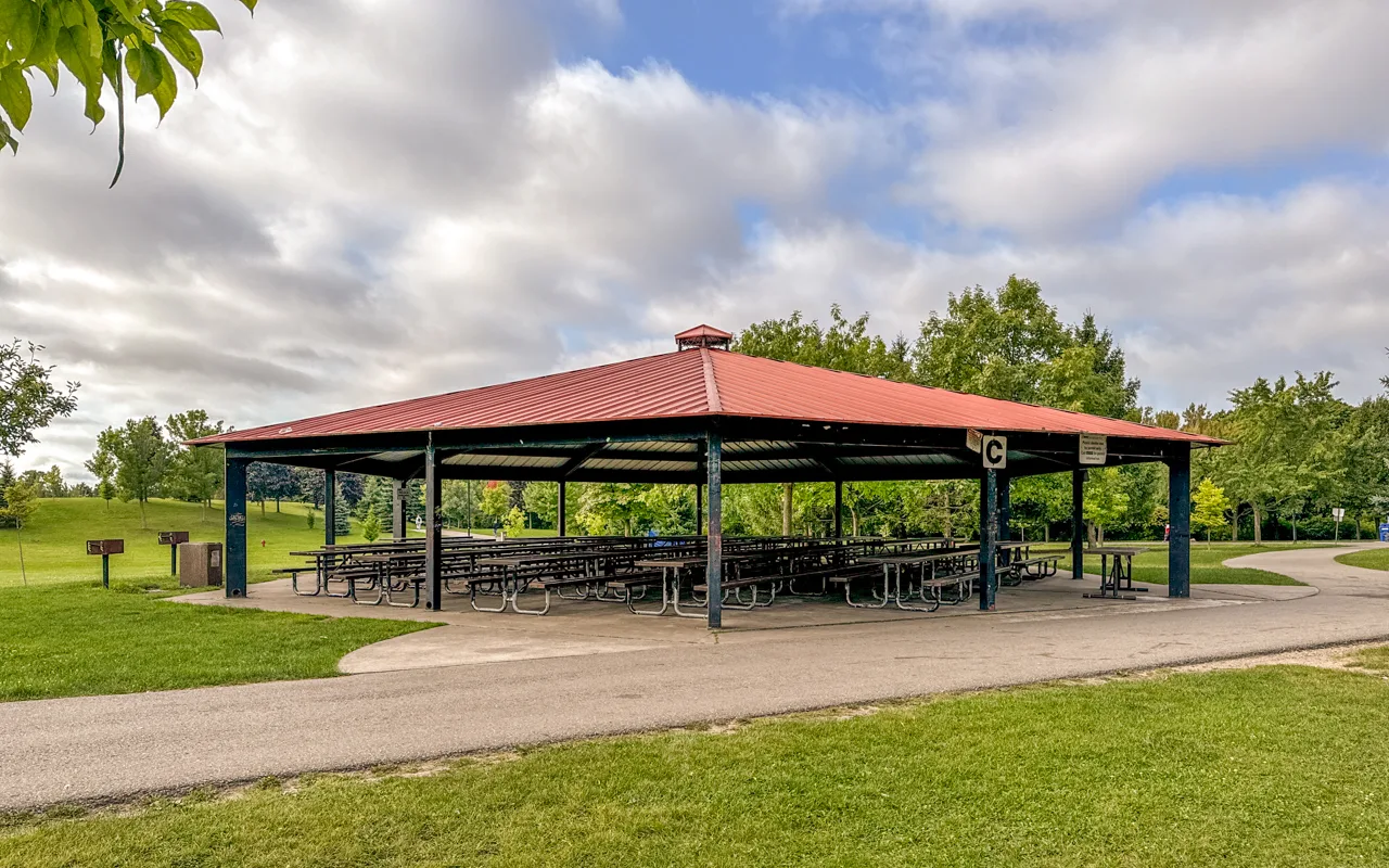 Picnic Site One under a large red-roofed shelter at Milliken Park