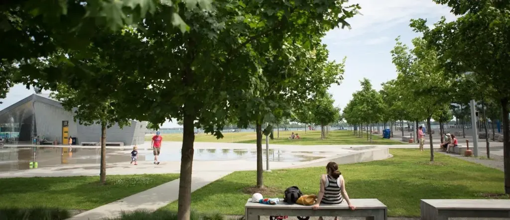 Flat paths, lawn and seating at Sherbourne Common beside Lake Ontario